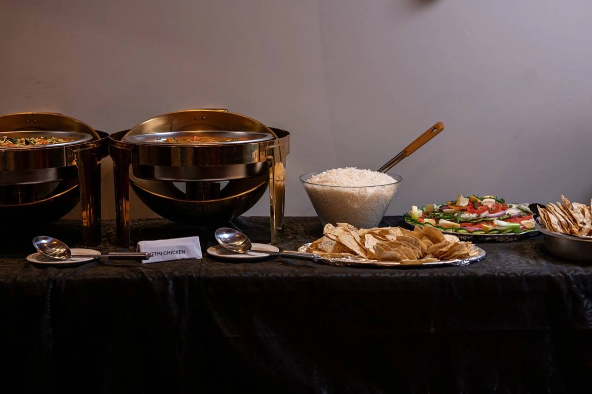 Catering buffet with rice and curries