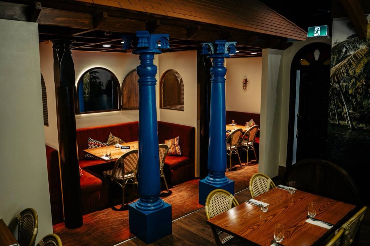The Mehfil Space with blue pillars and softly lit arches
